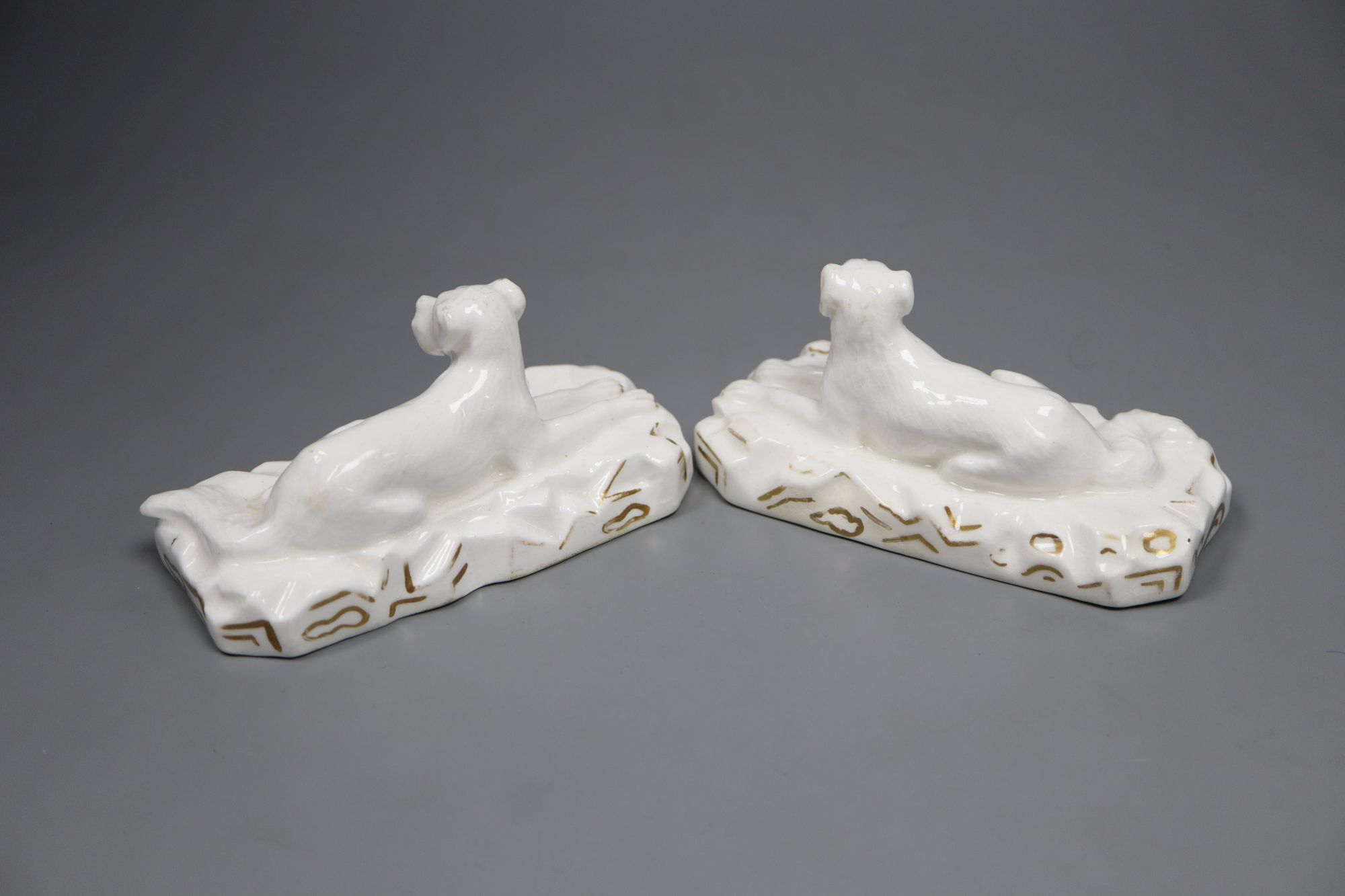 A pair of Grainger, Lee & Co. Worcester porcelain models of recumbent Great Danes, c.1820-37, 12.2cm long